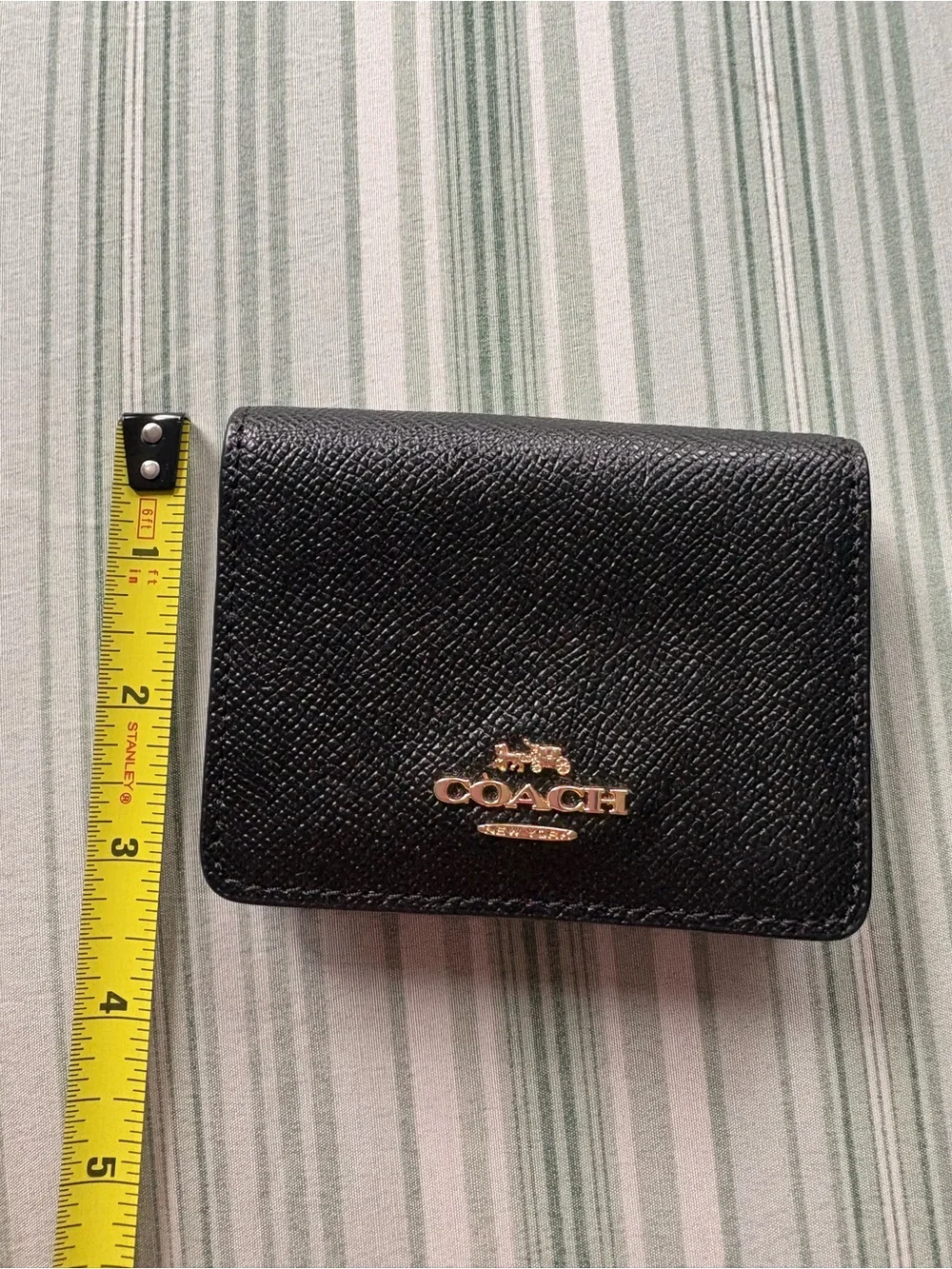 Coach Black Leather Compact Wallet with Gold Logo Accent